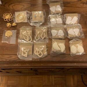 Vintage earrings and broches .Still unopened.